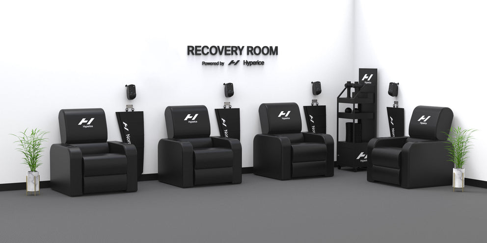 A 3D mock-up of a recovery room powered by Hyperice with dream chairs and normatecs stacked