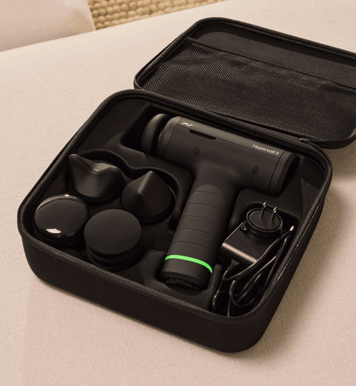 Hypervolt 3 with head attachments in its carry case